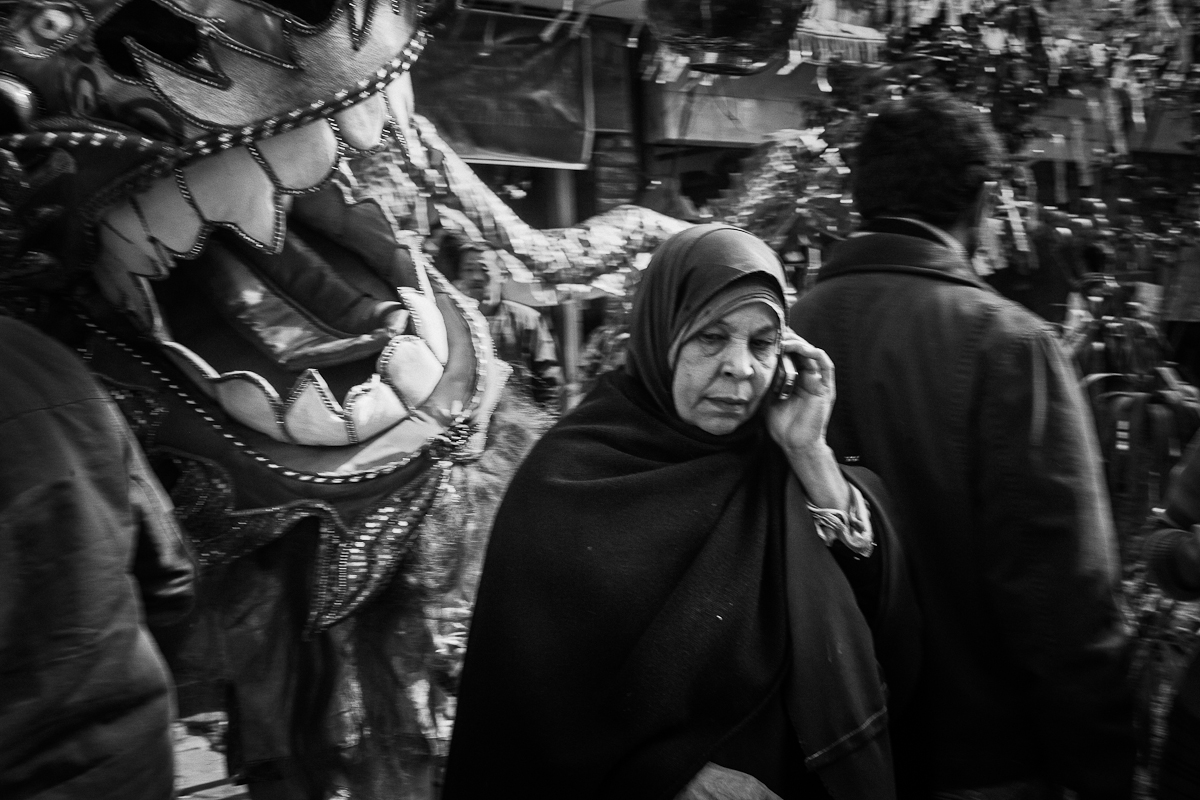 CAIRO, EGYPT - JANUARY 23 : Local Chinese residents watch as the dragon dance is preformed as part of the celebration for Chinese New Years on Degla Street in Maadi on January 23, 2012 in Cairo, Egypt. 