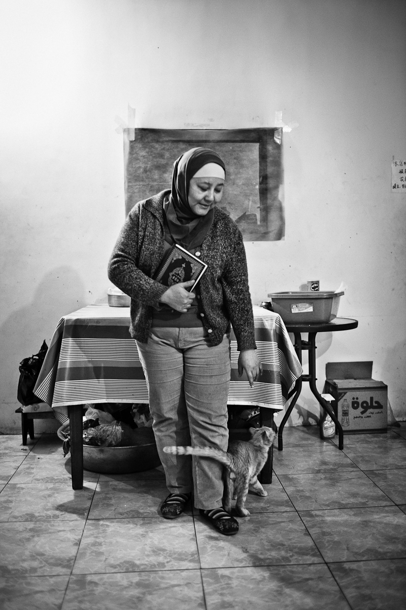 CAIRO, EGYPT - FEBRUARY 22 : Hagar Lin, an illegal Chinese migrant Muslim restaurant owner on February 22, 2012 in Abbaseya, Cairo, Egypt. Hagar came to Egypt when her daughter, once a student at the Al-Azhar University decided to stay in Egypt. Hagar runs a restaurant, illegally open to the public in a Muslim Chinese predominant neighborhood, Abbaseya.
