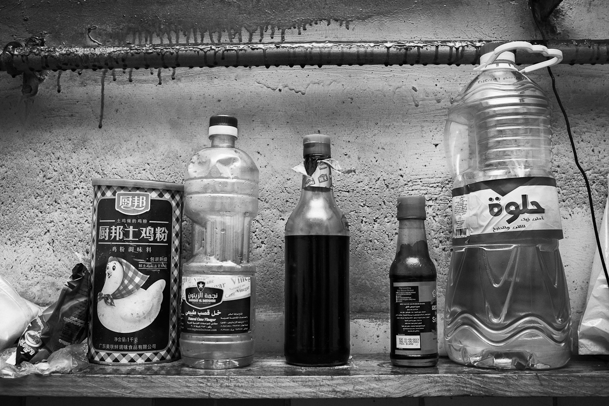 CAIRO, EGYPT - MAY 31 : Detail from a kitchen shelf shared by eight illegal Chinese migrant workers on May 31, 2012 El Geish Square in Cairo, Egypt. 