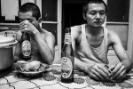 CAIRO, EGYPT - MAY 31 : Wu Qing and his son Qu Qing share an Egyptian Stella beer after after dinner on May 31, 2012 in Cairo, Egypt. 