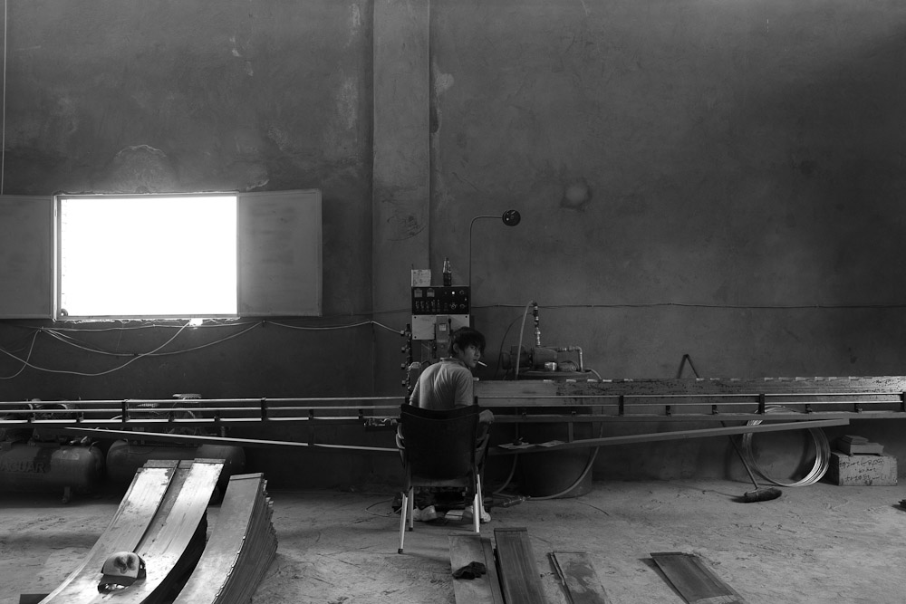 HELWAN, EGYPT - JUNE 18: Chinese employee work conveyer belt at in an mining yard on June 18, 2012 in Shak El Thoaban, in Helwan, Egypt. 