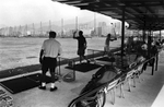 Hong Kongers enjoy an afternoon on the driving range of the once infamous Hong Kong Kai Tak International Airport. The story of Kai Tak started in 1922 when two businessmen Ho Kai and Au Tak formed the Kai Tak Investment Company in order to reclaim land in Kowloon for development. The land was acquired by the government for use as an airfield after the business plan failed. In 1924, Harry Abbott opened The Abbott School of Aviation on the piece of land. Soon, it became a small grass strip airport for the RAF and several flying clubs which, over time, grew to include the Hong Kong Flying Club, the Far East Flying Training School, and the Aero Club of Hong Kong which exist today as an amalgamation known as the Hong Kong Aviation Club. In 1928, a concrete slipway was built for seaplanes that used the adjoining Kowloon Bay which can be seen in old photographs. The first control tower and hangar at Kai Tak were built in 1935. In 1936, the first domestic airline in Hong Kong was established.Hong Kong Island