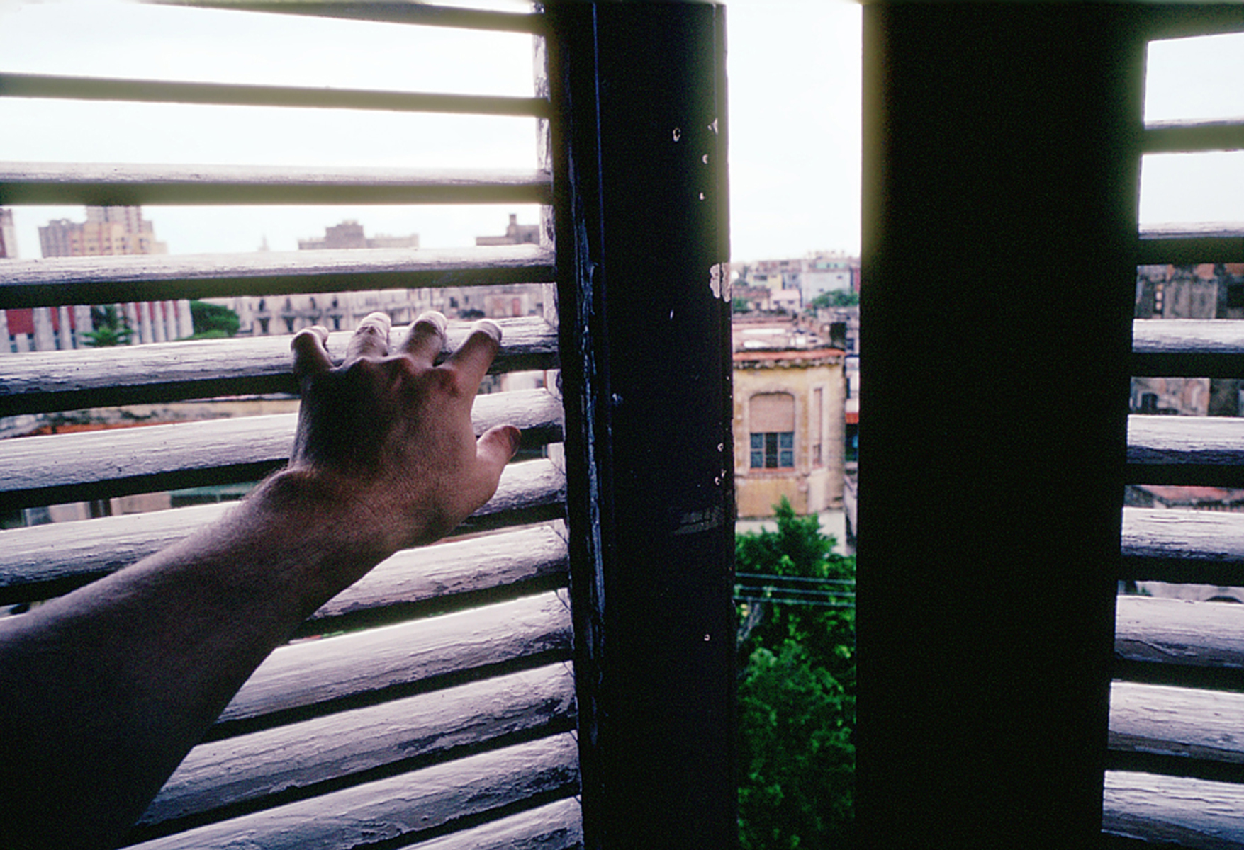 Often confined to a box of silent voices, whispers abound, as sentiment for the revolution dissipates, as if it were rain falling into the Caribbean. What can we do, but open our eyes and look beyond our window shades, beyond the iconic images of what has been left behind of our revolution, passed the horizon where we dream. Havana, Cuba