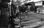 A worker is setting up for Mong Kok's Night Market in Yau Tsim Mong District. Kowloon Peninsula, Hong Kong