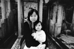 Chi Ying pays respect to her father, Cheung Chiu Lee, with her daughter at the Cheung Sha Wan Catholic Cemetery.Hong Kong Island