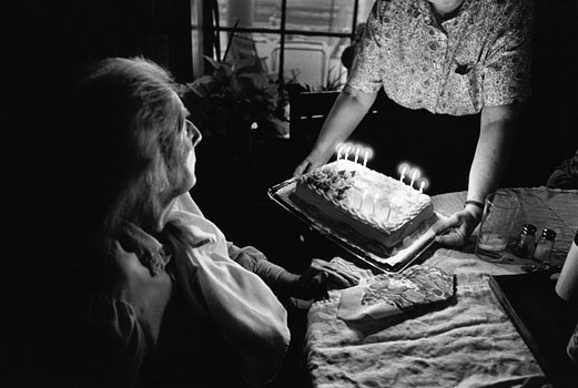 Marjorie's daughter, Mary Virginia, presents the 25th Wedding anniversary cake of Marjorie's eldest son Rowland who's name she can't remember. 1996