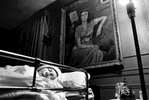 Unable to walk, Marjorie was moved downstairs in her Butler home. Ironically, she sleeps under a protrait of herself at age 24 painted by her late husband. 1996