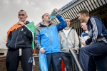 Young people celebrate Saint Patrick's day, in the Catholic Ardoyne area of north Belfast. The young man on the left has a tricolor flag, the national flag of the Republican of Ireland, draped around him.