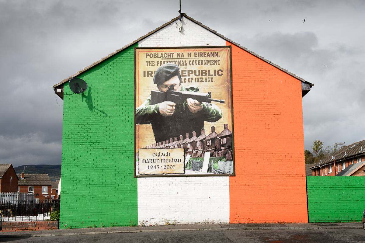 A republican mural depicting former north Belfast IRA volunteer Martin Meehan on a housing estate in the Catholic Ardoyne area of north Belfast. Northern Ireland has a long tradition of murals with paramilitary and historical narratives as dominating themes.Young people live in segregated neighborhoods where the violent past is normalized in barriers, murals and commemorations.