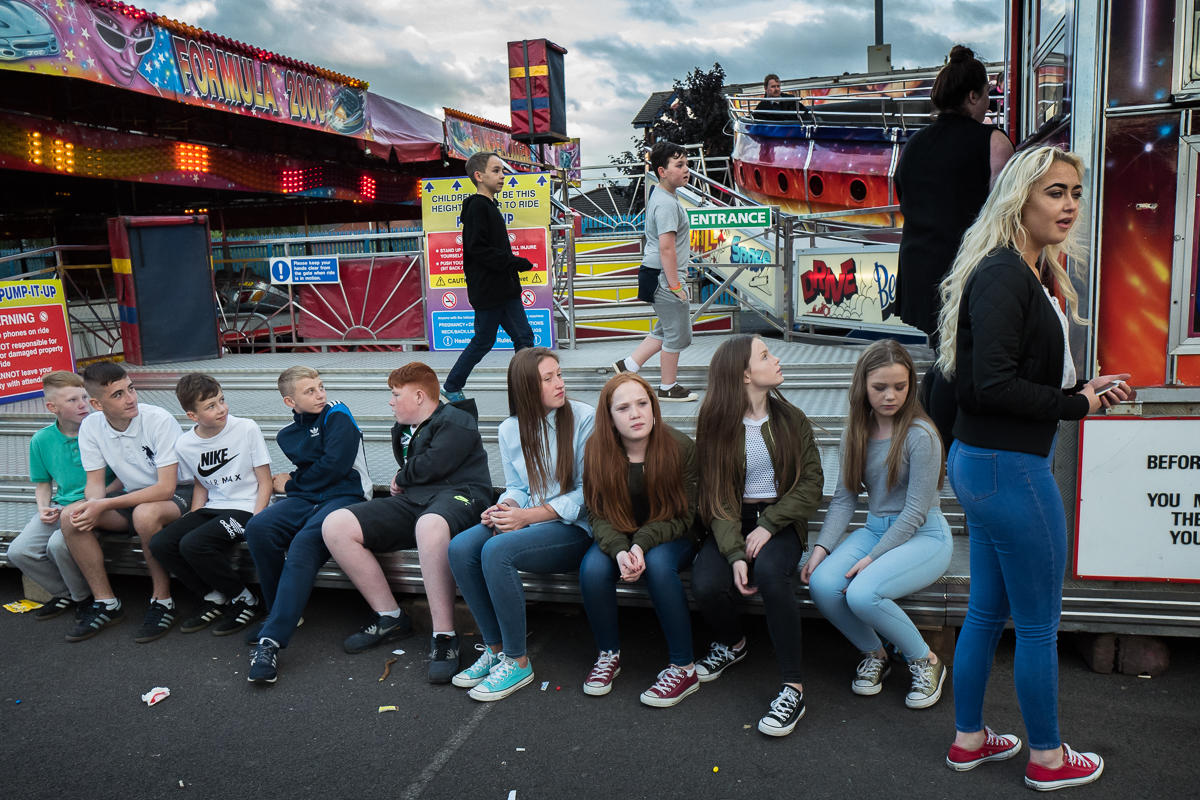 Teenagers hang out at a fun fair in the Catholic Ardoyne area of north Belfast. Traditionally the Protestant population constituted a majority in Belfast but  with the rapid increase in the Catholic population and the decline of the number of Protestants there is a shift in the city's demographic balance.