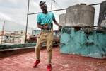 Habana Vieja, Havana   On a rooftop in the Habana Vieja neighborhood, Cristian Ramon  Kindelán, 17, - stage name El Yabo- , dances to a song by the Reggeaton band he put together with 3 friends. Reggeaton music is highly popular in Havana. Back in 2011 the government considered it a menace to the richness of Cuban music and tried to stop it. But this music genre survived and the government relaxed its restrictions. Now reggeaton music and its fashion influence are everywhere in Havana.