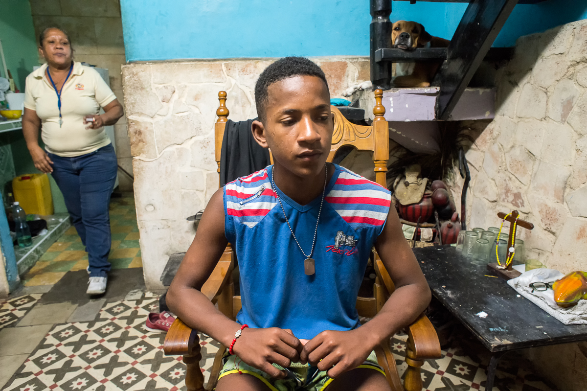 Centro Habana, Havana   Yorlanis Veitia , 16,  sits in a rocking chair in the living room of the small house where he lives with his mother who works in  a state-owned fast food restaurant. They have a hard time meetings ends. An average state salary is less than $20 and even though most people find a way to make some money on the side, having enough to satisfy all necessities is often a struggle.