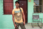 El Cerro, Havana   Yulien, 25, poses for a portrait in front of his house in the El Cerro municipality.
