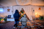 Calais, December 2014 Eritrean women pray in a makeshift church set up by the Eritrean community in the Tioxide jungle camp.