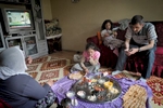 Bekir Basak, his wife Zeynab and their two youngest children Tugba and Kübra have breakfast. Forty-one-year old  Bekir, became ill after having worked ten years in a sandblasting workshop.