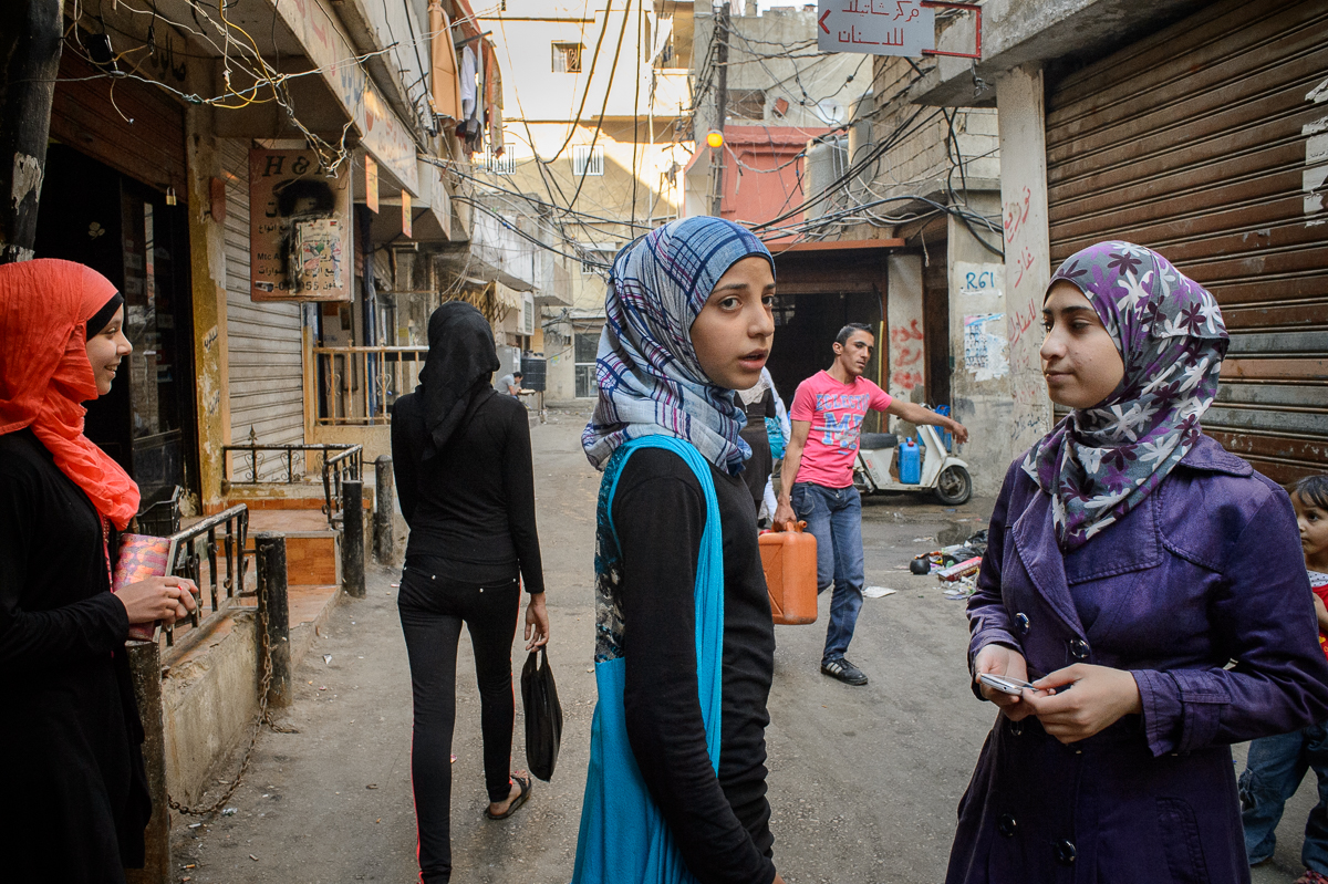 Marwa Hazineh (13) and her friends Asmaa, Esraa and Arej, all of them Palestinian refugees from Syria, stand on a street in Shatila. Except Marwa, none of the girls go to school anymore.