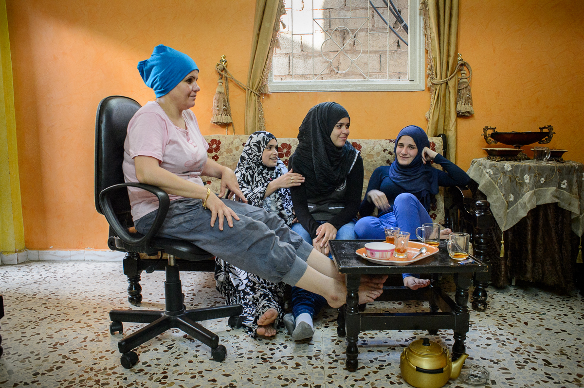On a visit to the house of the Abed El Hade family, Fati-ma Gazzawi (16) drinks tea with her friend Fatima (17) and her family.
