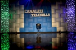 Televolla, one of the numerous TV stations entirely consecrated to neomelodica music. Wanting to promote themselves as live performers at private parties, singers pay to appear on TV shows. Neomelodici gain most money from performances at birthdays, communions, marriages and other private parties.