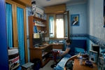Lucio (12) is seen getting ready for school in his room.