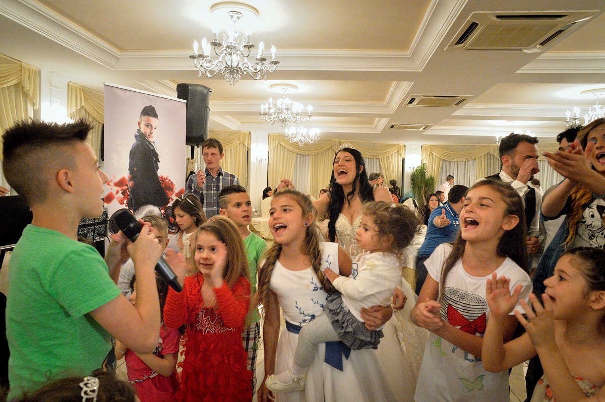 Sasà (11) sings at a wedding in a banquet hall in Trecase, at the foot of Mount Vesuvius. At a wedding it is not rare to have a succession of both adult and child singers.