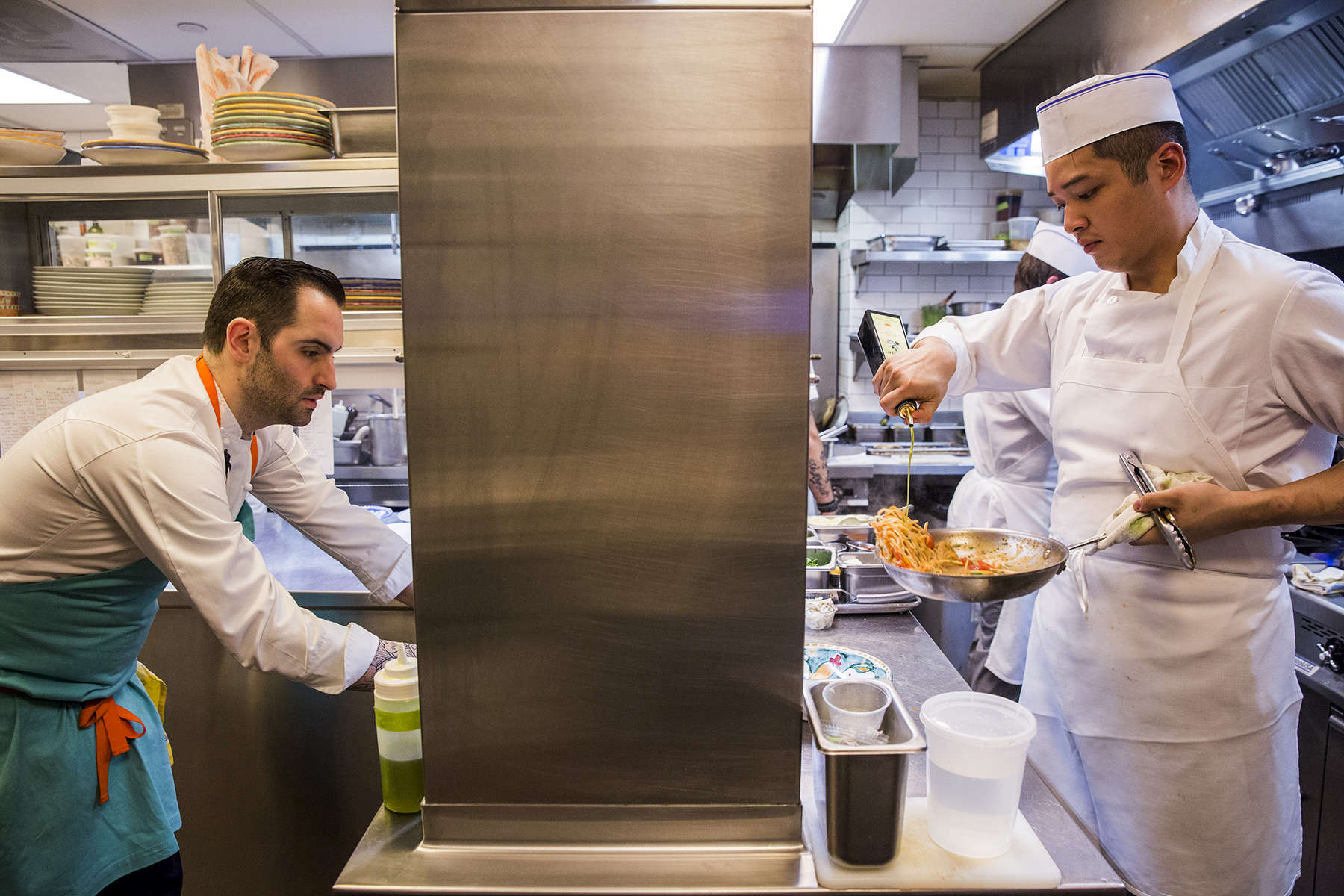 Chef Mario Carbone (left) in the kitchen of Santina Restaurant in New York, NY