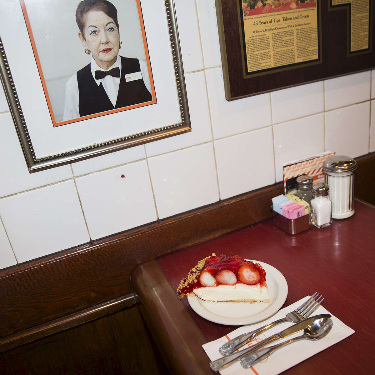 Next up on my A to Z of New York Food: J IS FOR JUNIOR’S! Many things about Junior’s Cheesecake probably changed in the 43 years that Mary Blevins (pictured) worked there. I’m pretty sure none of those changes were to the cheesecake recipe that has been in founder Harry Rosen’s family for three generations. Not pictured is the slice of Junior’s No. 1 Original Cheesecake that proceeded the pictured strawberry cheesecake. Both tasted the same as they did when I last had them years ago and I’m pretty sure they’ll be the same in however many years I go back, and that makes me happy. Junior’s cheesecakes are available in stores around the country but they're far more enjoyable under Mary’s watchful eye in the original Brooklyn location, surrounded by 64 years of Junior’s history. Share your J Food photo with #TNYeats so everyone can see them! #newyork #cake #food. Photo: @jamespomerantz