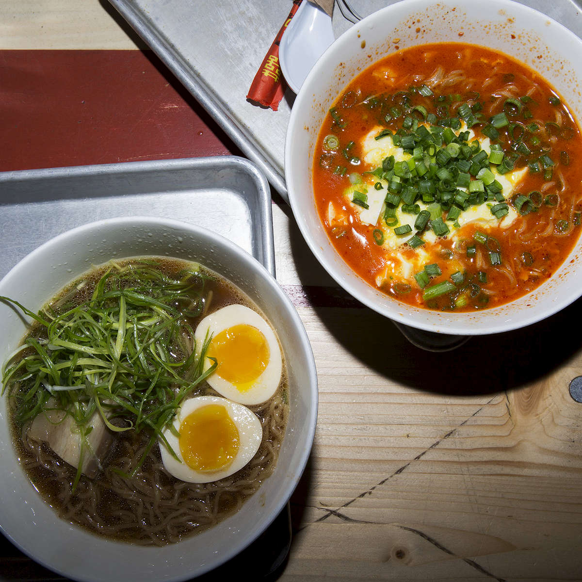 Next up on my A to Z of New York Food: R IS FOR RAMEN! Once upon a time the only ramen I knew was of the dried, just add water variety. Some days I was too lazy to add water and would just sprinkle on the salty chicken MSG powder pack and crunch away. It wasn’t until a trip to Japan years later that I first tasted artisanal ramen soup. Handmade noodles, rich pork bone broth and a variety of tasty toppings including egg, bamboo and slices of roast pork. Thankfully there is now world-class ramen in New York. These two pictured are from Ivan Ramen Slurp Shop. Originally from Long Island, Ivan Orkin headed to Japan and shocked the noodle-loving nation when he opened what would become one of Tokyo’s best ramen shops. Last year, Ivan returned to open his first US branch in Manhattan's Gotham West Market and has since added another on the Lower East Side (Ivan is just like Ralph Macchio in Karate Kid, Part Two but with noodles). Take advantage of the incoming cold weather and go see @ramenjunkie for a bowl that’s good enough to drag my lazy ass out of bed. #newyork #ramen #food. Tag your R Food/Drink photos with #TNYeats so everyone can see them! Photo:@jamespomerantz