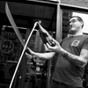 S IS FOR SABERING! There was a time not too long ago that if someone mentioned a tattooed guy on Bowery wielding a sword, you would have steered clear. Now the chances are that the sword-swinging somebody is sommelier @patrickwine of @pearlandashnyc restaurant opening a bottle of bubbles with a big ass blade in front of a packed house. Patrick, formerly the besuited Wine Director of Gilt restaurant, traded in his two-piece for a t-shirt and is representative of a more approachable, affordable and fun wine world. Patrick can still wax poetic about the Comtes Lafon on his wine list for over $2,000 but he’s even more passionate about the far more numerous wines he has for under $40. Any night is a great night for champagne but I can think of few nights more suitable for sabering than Halloween. #wine #sabertownusa #food #newyork. Tag your S Food/Drink photos with #TNYeats for the universe to see! Photo: @jamespomerantz.