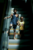Baton Rouge 9/6/05 From left, Vincent Phillips (cq), 2, and his nephew Koymani Umine (cq), 2, descend the escalator at an evacuee shelter in Baton Rouge, La. Tuesday, September 6 2005.   Approximately 500 children are being housed at the shelter.Globe Photo/Erik JacobsSlug:Reporter: Raja Mishra