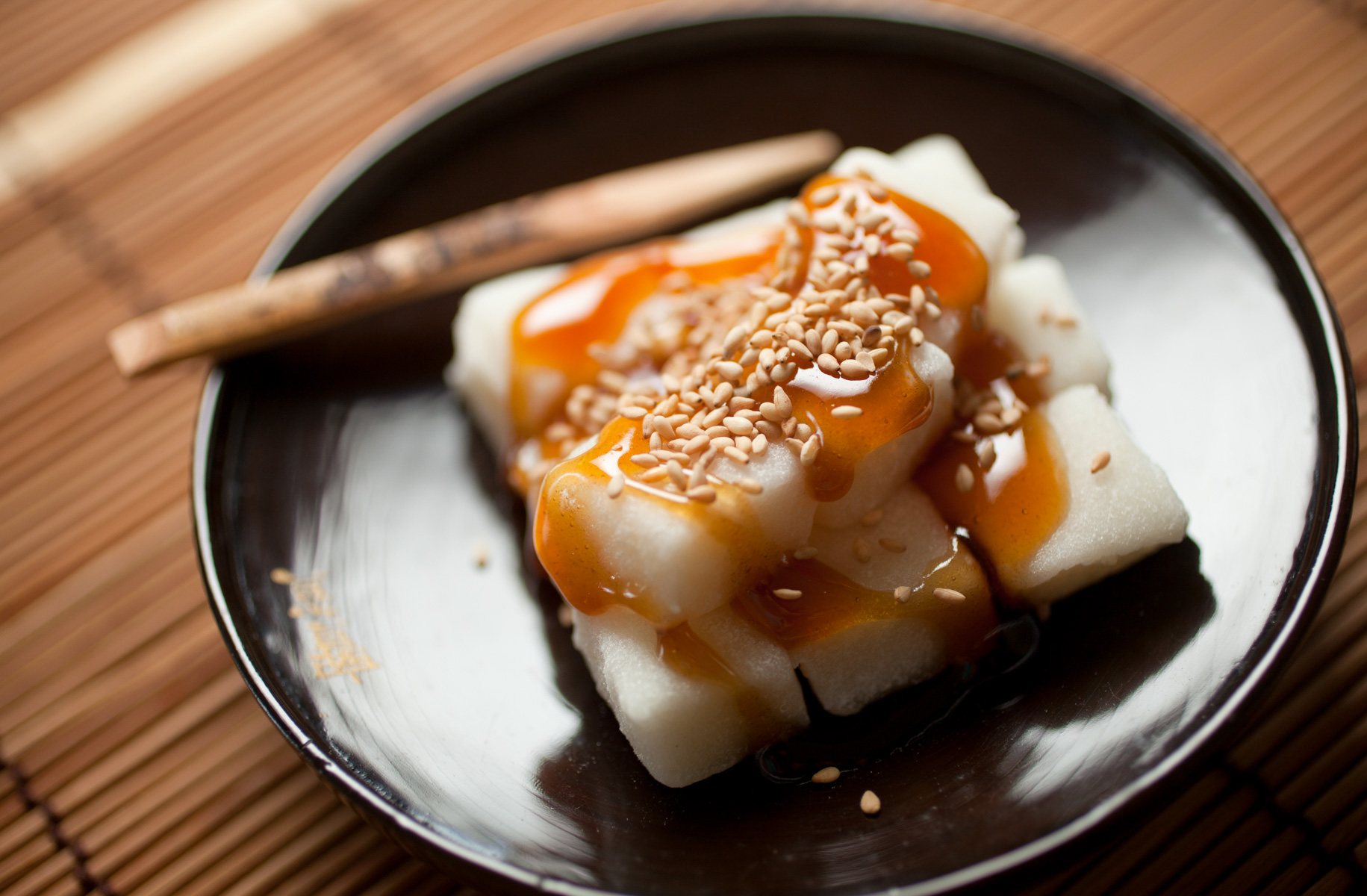 5/24/12 Somerville, MA -- A photo of Mitarashi, which is mochi  covered with a sweet soy sauce glaze and sesame seeds May 24, 2012.  Erik Jacobs for the Boston Globe