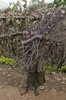 Girl collecting sticks, Rwanda