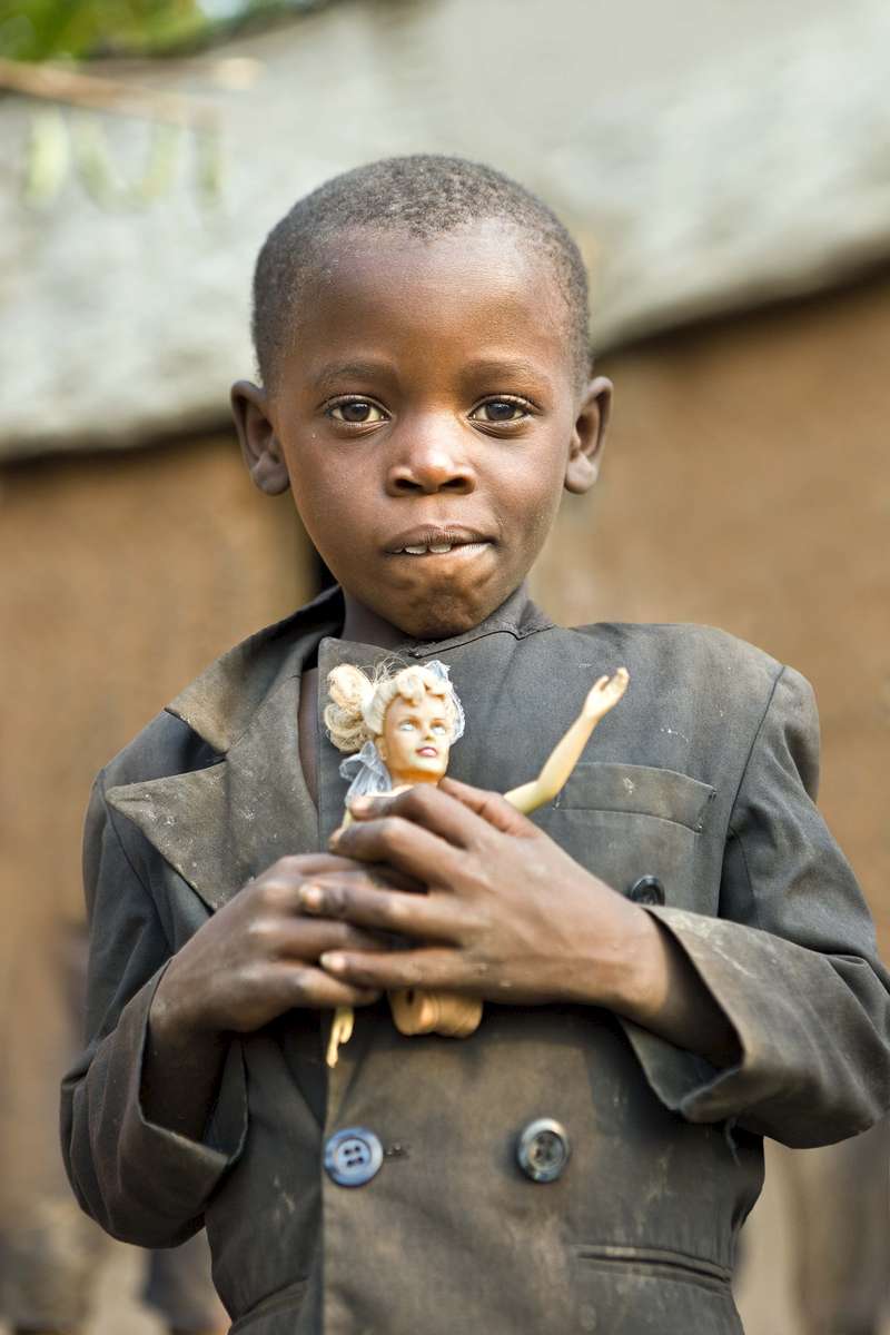 Batwa boy with a toy, Rwanda