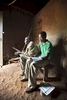Student at home with his grandfather, Rwanda