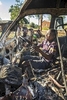 Kids playing in a burned out minibus, Malawi
