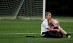 Waccamaw girl's soccer player Abby Weimer,12, (left) consoles teammate Callie Dennis, 11, after the Warriors lost 1-0 to Bishop England High School in the Lower State Championship game held at Waccamaw.