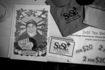 SXSE swag for sale during the Randall Bramblett show on December 3, 2016. Pictured is a poster of the late Jeff Roberts nicknamed {quote}The Minister of Music{quote} by his close friends. Roberts was one of the founders of the series and his memory is honored with a toast before each show.