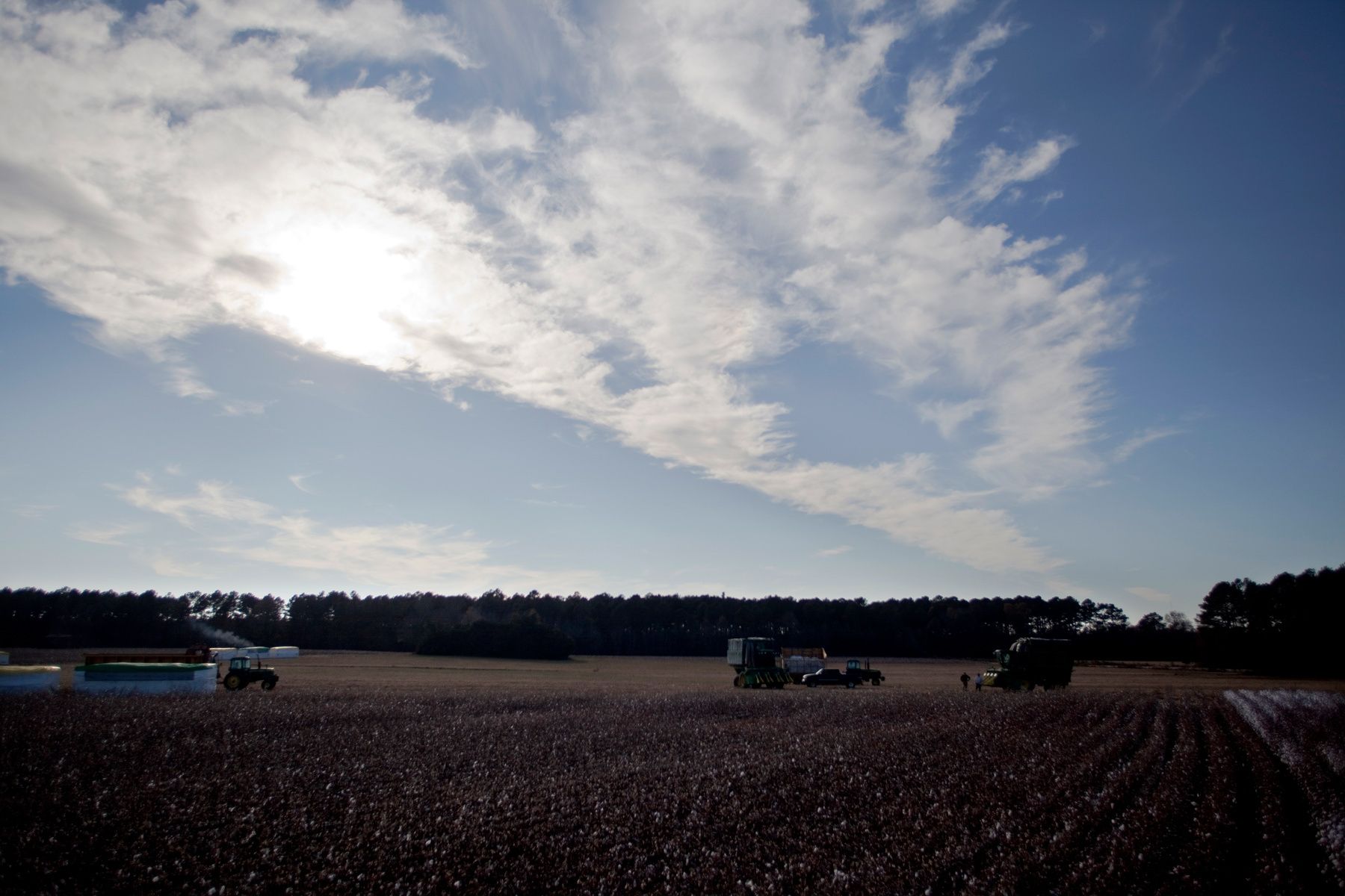 Cotton workers and their equipment are placed on the edge of a field for Baxley & Baxley Farms on a tract in Minturn, South Carolina November 24, 2012. The cotton harvest takes place in South Carolina from October through November and is planted and grows along a corridor approximately 30 miles on each side of Interstate I-95. About 80 percent of the cotton harvested by this farm is exported outside the United States. REUTERS/Randall Hill (UNITED STATES)
