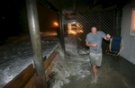 Gordon Roberts of Ocean Isle Beach runs from a storm surge at his home on East Third Street on September 5, 2008, during the effects of tropical storm Hanna in Ocean Isle Beach. Because of ongoing beach erosion problems, many east end residents fear tropical storm Hanna could cause severe damage to area homes if it hits at high tide.