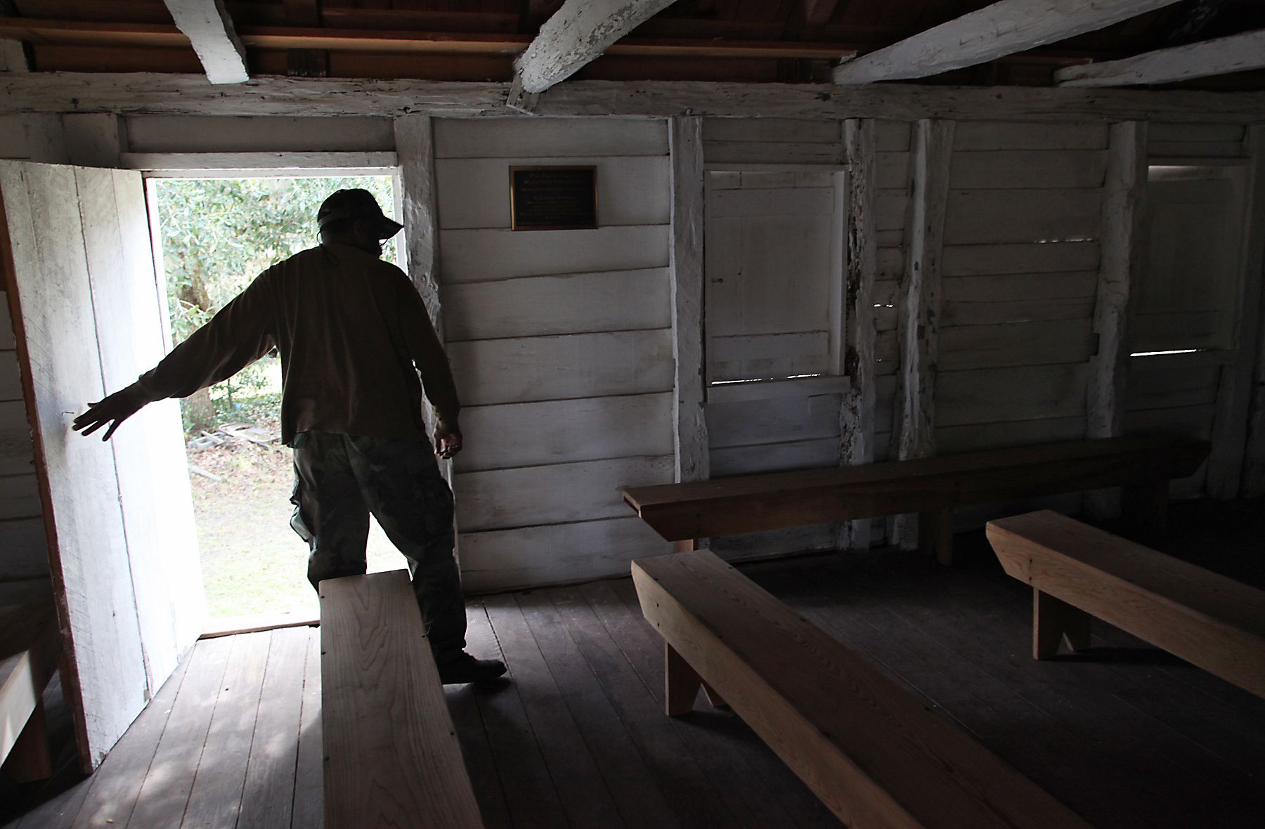 Plantation grounds keeper Cliff Ford walks through the restored slave chapel February 23, 2012, at Mansfield Plantation in Georgetown, S.C. The chapel was restored in 2006 by current owner John Parker of Asheville, N.C. Ford claims he has at times felt the spirits of the slaves who worshiped at the chapel. {quote}I think they are happy we are taking care of their church,{quote} he said. {quote}It leaves me with a good feeling.{quote} The plantation is a National Historic Landmark consisting of 893 acres located on Black River in Georgetown County. In the South Carolina Lowcountry, more than a half-dozen antebellum plantations, which don't change hands often, are for sale. REUTERS/Randall Hill