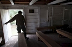 Plantation grounds keeper Cliff Ford walks through the restored slave chapel February 23, 2012, at Mansfield Plantation in Georgetown, S.C. The chapel was restored in 2006 by current owner John Parker of Asheville, N.C. Ford claims he has at times felt the spirits of the slaves who worshiped at the chapel. {quote}I think they are happy we are taking care of their church,{quote} he said. {quote}It leaves me with a good feeling.{quote} The plantation is a National Historic Landmark consisting of 893 acres located on Black River in Georgetown County. In the South Carolina Lowcountry, more than a half-dozen antebellum plantations, which don't change hands often, are for sale. REUTERS/Randall Hill