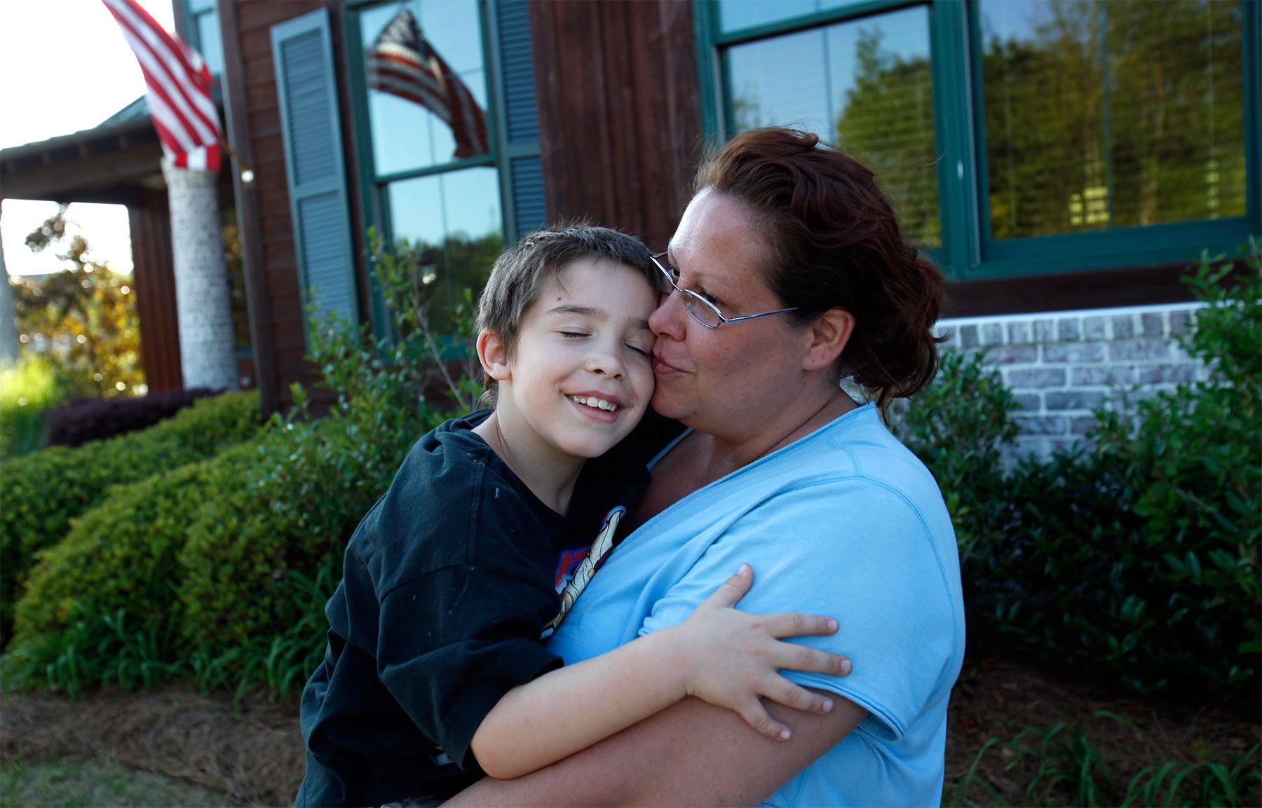 Six-year-old Jacob Cushman hugs his mother Cathryn Monday at the Residents' Club in North Myrtle Beach after searching for donated goods. The Cushman's rental home on Club Course Dr. in Barefoot Resort was a complete loss after the fire. {quote}People have been angels to us,{quote} said Cathryn while standing outside the clubhouse where a donation center has been started for victims of the fire. Still, with donations of toys for Jacob and his little brother Matthew, all the family’s household items were destroyed in the fire. The family had only moved into the house in Barefoot Resort for one week.
