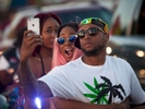 Festival goers take a group selfie while waiting in traffic on Ocean Boulevard during the 2015 Atlantic Beach Memorial Day BikeFest in Myrtle Beach, South Carolina May 24, 2015. After three people were killed and seven wounded in shootings during 2014 Bikefest, State officials called for an end to the event that draws thousands to the family-friendly beach town. Their efforts were unsuccessful. Bikers returned to Myrtle Beach - just a week after a bloody motorcycle gang shootout in Waco, Texas. But this time authorities are more prepared, with dozens of new surveillance cameras and a police force three times the size of last year's. REUTERS/Randall Hill