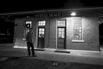 After sound check at the SXSE show on Saturday December 3, 2016, current SXSE president Seth Funderburk takes a break outside the Historic Myrtle Beach Train Depot before the Randall Bramblett show.