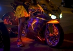A customized sport bike is lit in neon lights as it's driver waits in traffic on Ocean Boulevard during the 2015 Atlantic Beach Memorial Day BikeFest in Myrtle Beach, South Carolina May 24, 2015. After three people were killed and seven wounded in shootings during 2014 Bikefest, State officials called for an end to the event that draws thousands to the family-friendly beach town. Their efforts were unsuccessful. Bikers returned to Myrtle Beach - just a week after a bloody motorcycle gang shootout in Waco, Texas. But this time authorities are more prepared, with dozens of new surveillance cameras and a police force three times the size of last year's. REUTERS/Randall Hill