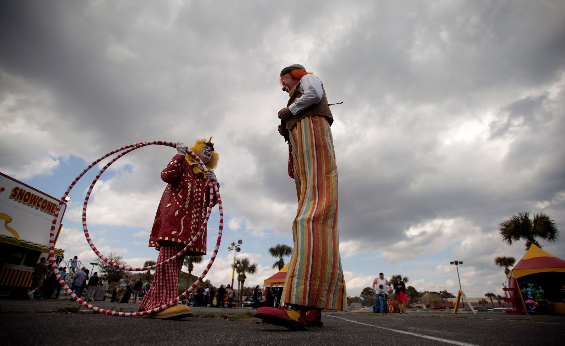 Josh Dummitt (center) as Meatball the clown and Julius Carallo as Clown Chips, prepare for the Cole Brothers Circus of the Stars show in Myrtle Beach, South Carolina March 31, 2013. Traveling circuses such as the Cole Brothers Circus of the Stars, complete with it's traveling big top tent, set up their tent city in smaller markets all along the East Coast of the United States as they aim to bring the circus to rural areas. The Cole Brothers Circus, now in its 129th edition, travels to 100 cities in 20-25 states and stages 250 shows a year.    For Reuters