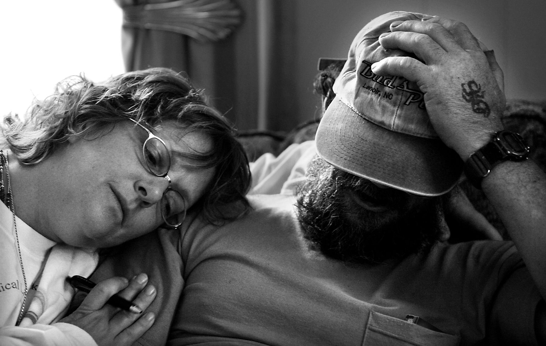 On the day after their mother died, Cassie comforts her brother Mike Snelson while the family make arrangements for Pat's memorial service.