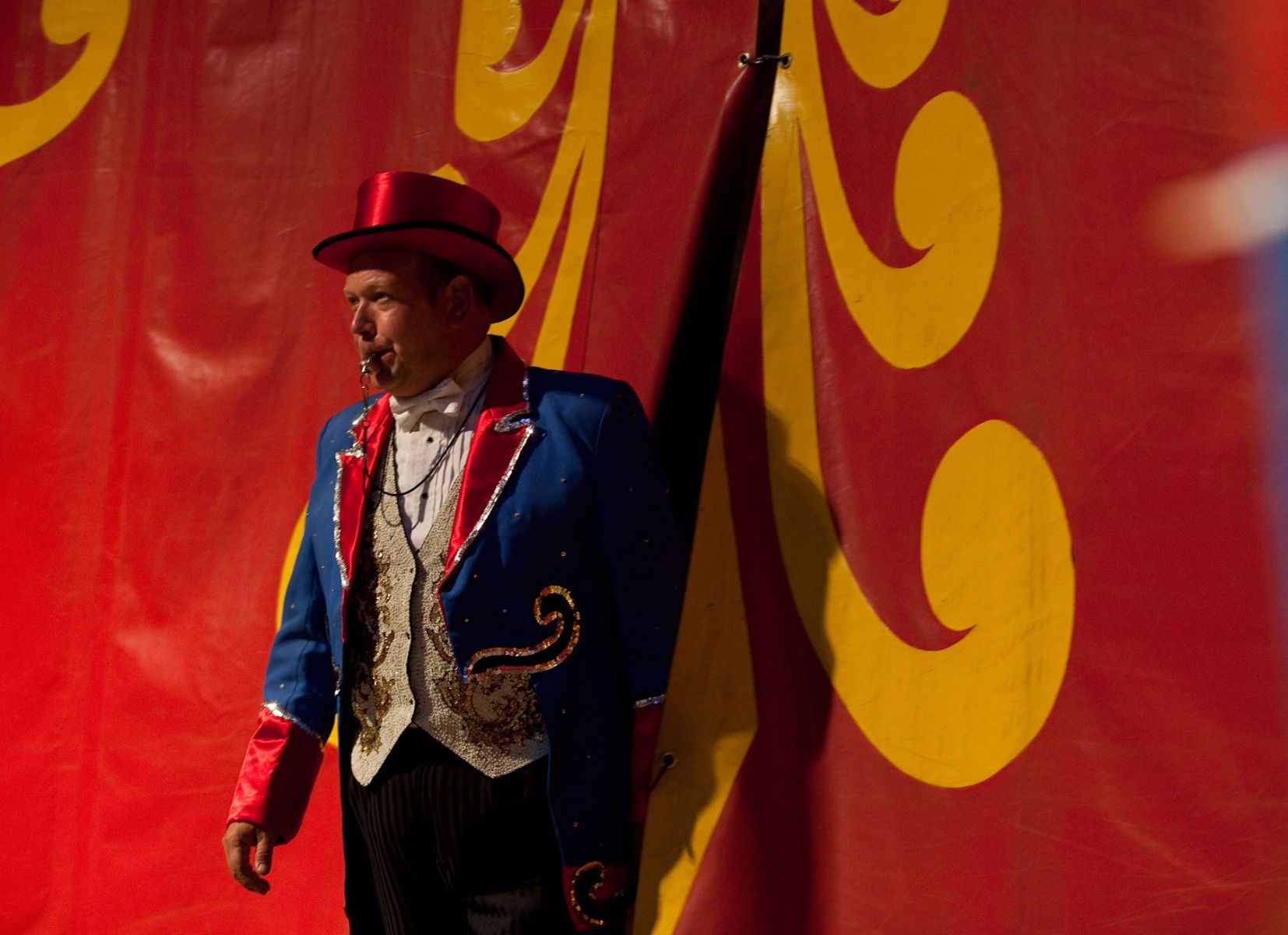 Ringmaster Chris Connors starts the second show of the evening with a blow of his whistle during the Cole Brothers Circus of the Stars stop in Myrtle Beach, South Carolina March 31, 2013. Traveling circuses such as the Cole Brothers Circus of the Stars, complete with it's traveling big top tent, set up their tent city in smaller markets all along the East Coast of the United States as they aim to bring the circus to rural areas. The Cole Brothers Circus, now in its 129th edition, travels to 100 cities in 20-25 states and stages 250 shows a year.   REUTERS/Randall Hill   (UNITED STATES)